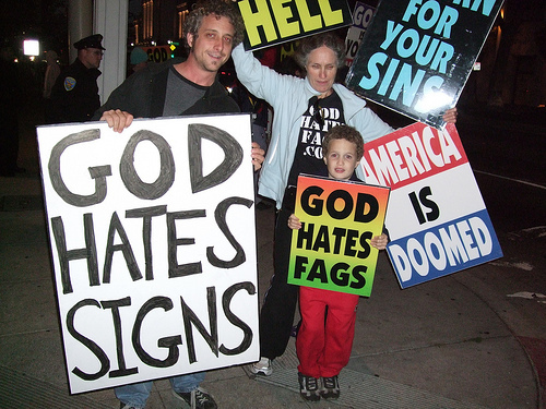 Westboro Baptist Church protester and counter protester at funeral of dead American soldier