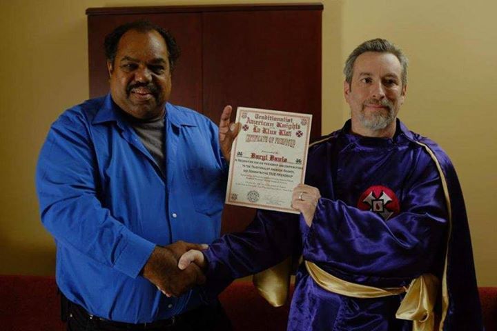 Daryl Davis (L) being presented with a