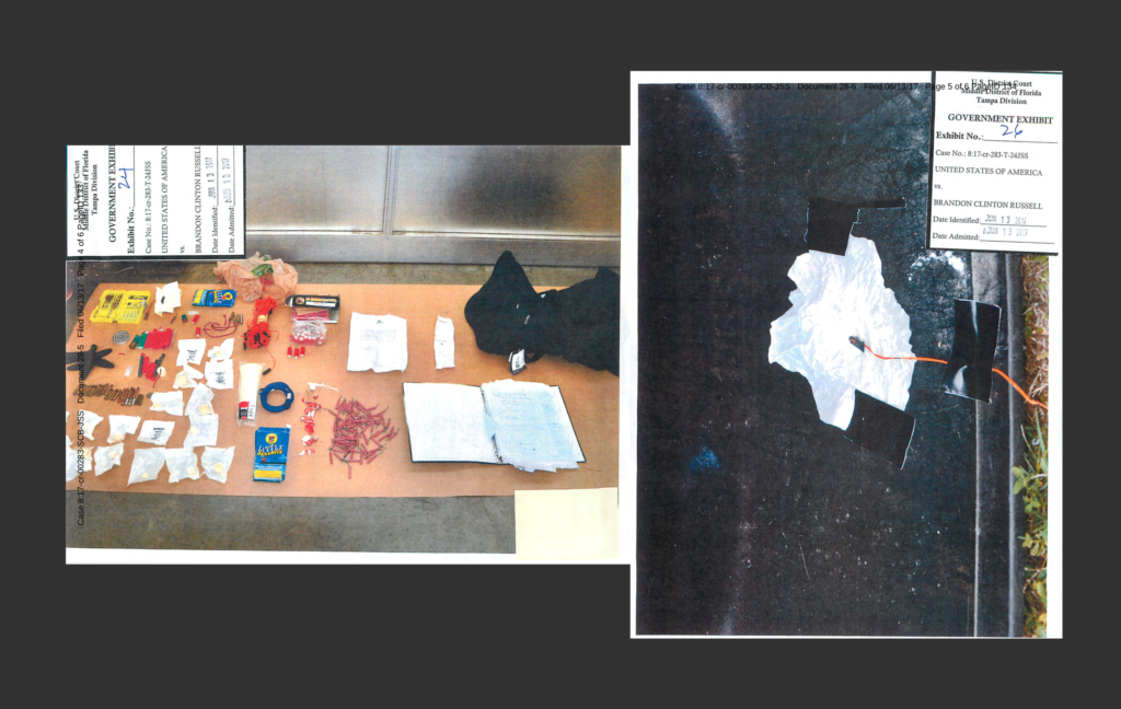 Two legal exhibit pages from the U.S. District Court case of United States of America vs. Brandon Clinton Russell. Exhibit 24 shows a collection of items including tools, small packets, wires, and a notebook laid out on a surface. Exhibit 26 shows a close-up of a white material taped to a dark surface with a wire attached.