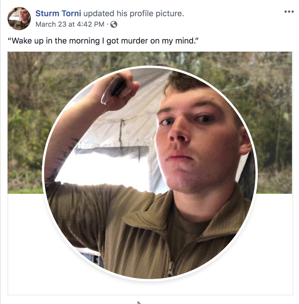 A screenshot of a Facebook profile update for 'Sturm Torni'. The profile picture shows a young Caucasian man with short brown hair wearing a military-style tan uniform. The post caption reads, 'Wake up in the morning I got murder on my mind.'