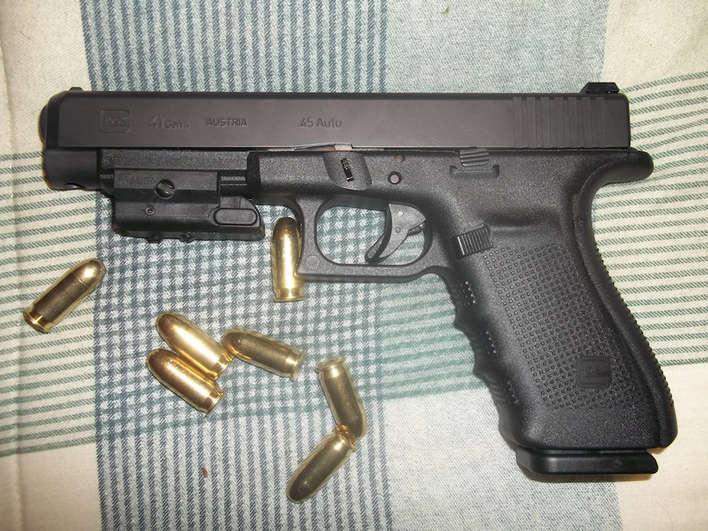 Photo of Dylann Roof's .45 Glock which he was gifted for his birthday and used on June 17 to murder 9 members of a Black church in Charleston, South Carolina