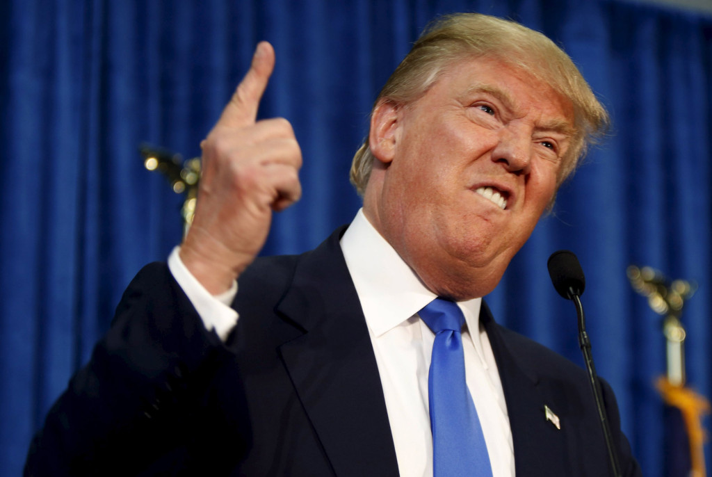 Republican presidential candidate Donald Trump gestures and declares