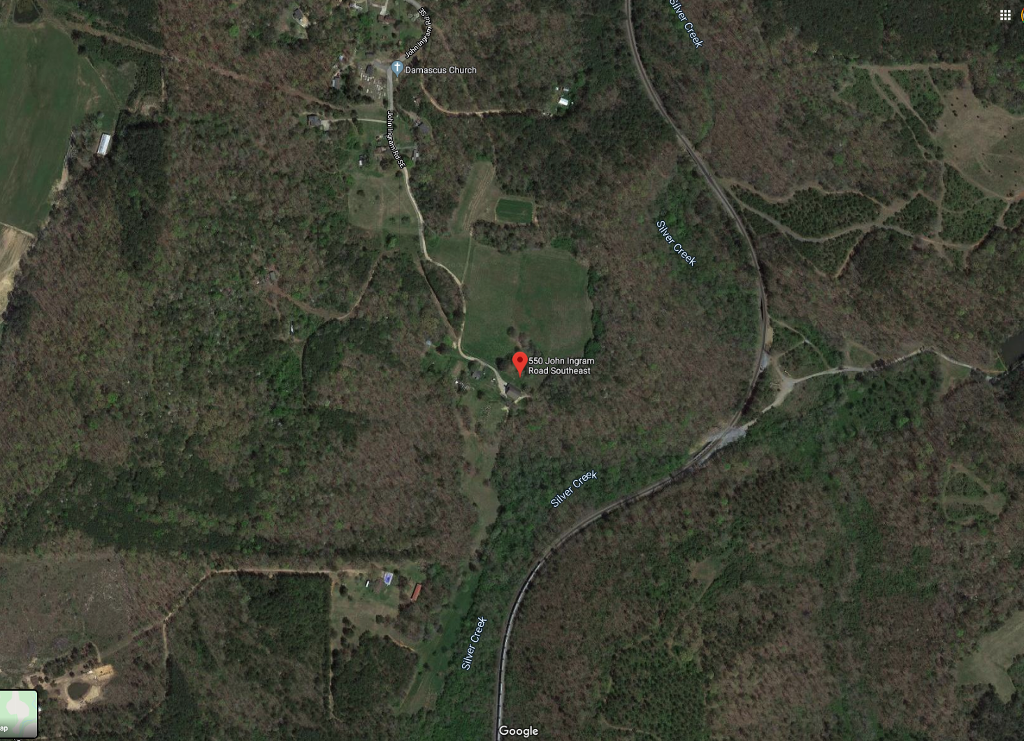 A satellite map view from Google Maps showing a rural wooded area with a red location pin at 550 John Ingram Road Southeast. Nearby landmarks include Damascus Church and Silver Creek.