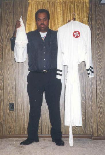 Davis with a Klan robe given to him by a former Imperial Wizard who left the Klan
