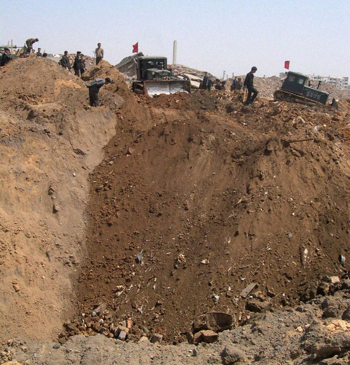 Photo of crater after explosion, Ryongchon 2004 | Picture credit: David Hill, ECHO