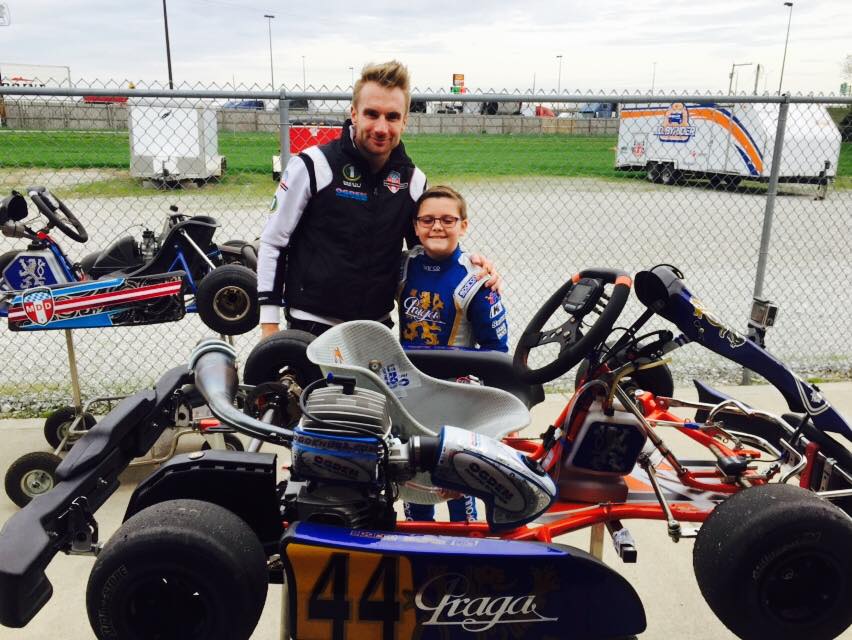 10 year old Philip Savopoulos in his racing go kart earlier this year with his coach, professional Indy Race driver Jay Howard