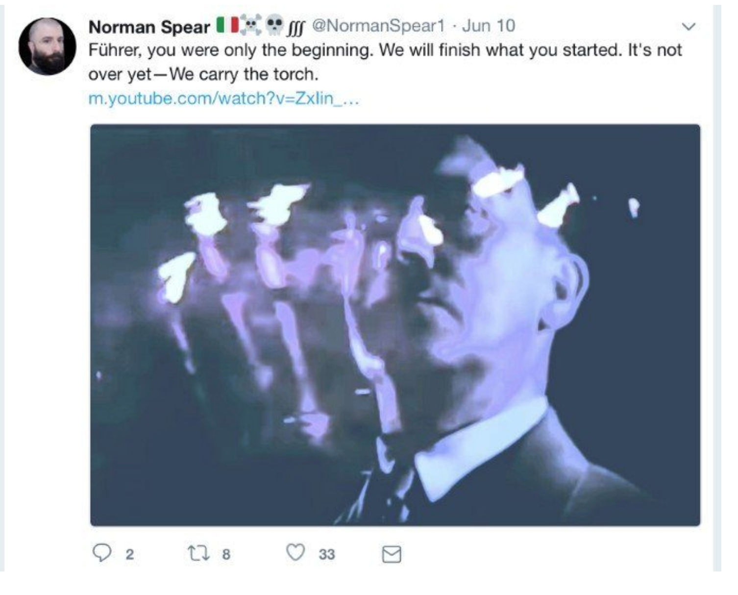A screenshot of a tweet from 'Norman Spear' featuring a distorted, blue-toned image of Adolf Hitler with glowing torch-like shapes. The tweet text reads: 'Führer, you were only the beginning. We will finish what you started. It's not over yet—We carry the torch.'