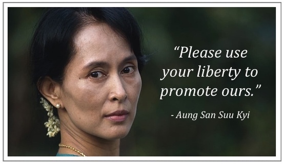 A portrait of Aung San Suu Kyi with a quote that reads 'Please use your liberty to promote ours.'