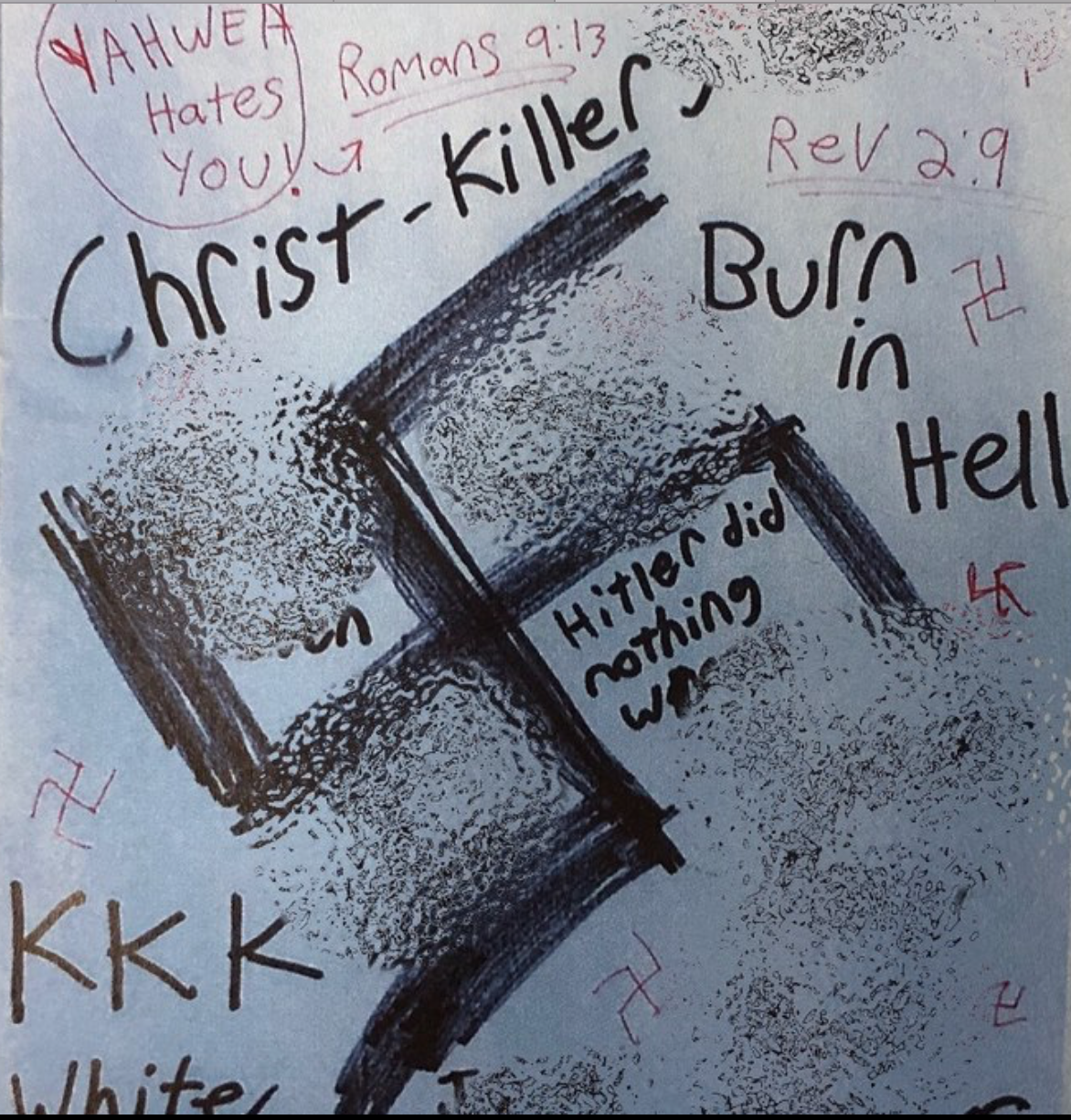 A photograph of a flyer containing white supremacist and anti-Semitic hate speech, including swastikas, 'KKK', and phrases like 'Christ-Killer' and 'Hitler did nothing wrong'.