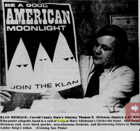 A black and white newspaper photograph showing Carroll County State's Attorney Thomas E. Hickman holding a Ku Klux Klan recruitment poster that reads 'BE A GOOD AMERICAN MOONLIGHT JOIN THE KLAN'.