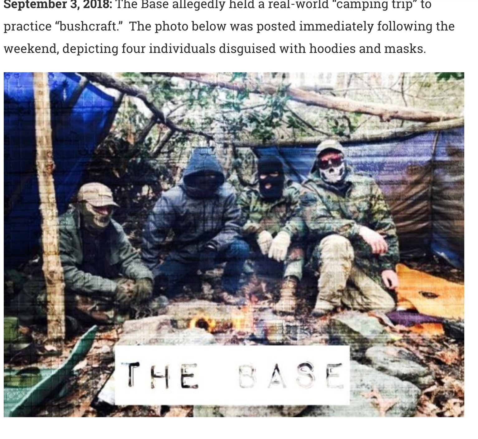 A screenshot featuring a photograph of four masked individuals in camouflage and tactical gear sitting around a campfire in a wooded setting. The text above describes a 'camping trip' by the group 'The Base' in September 2018. A white banner at the bottom reads 'THE BASE'.