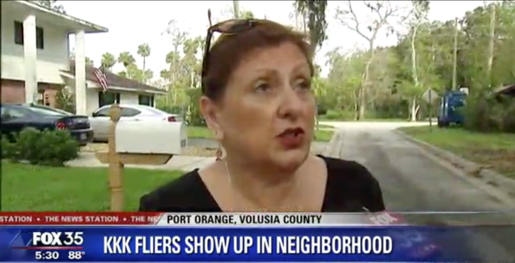 A screenshot of a FOX 35 news report featuring an interview with a woman in Port Orange, Volusia County, regarding KKK fliers appearing in the neighborhood.